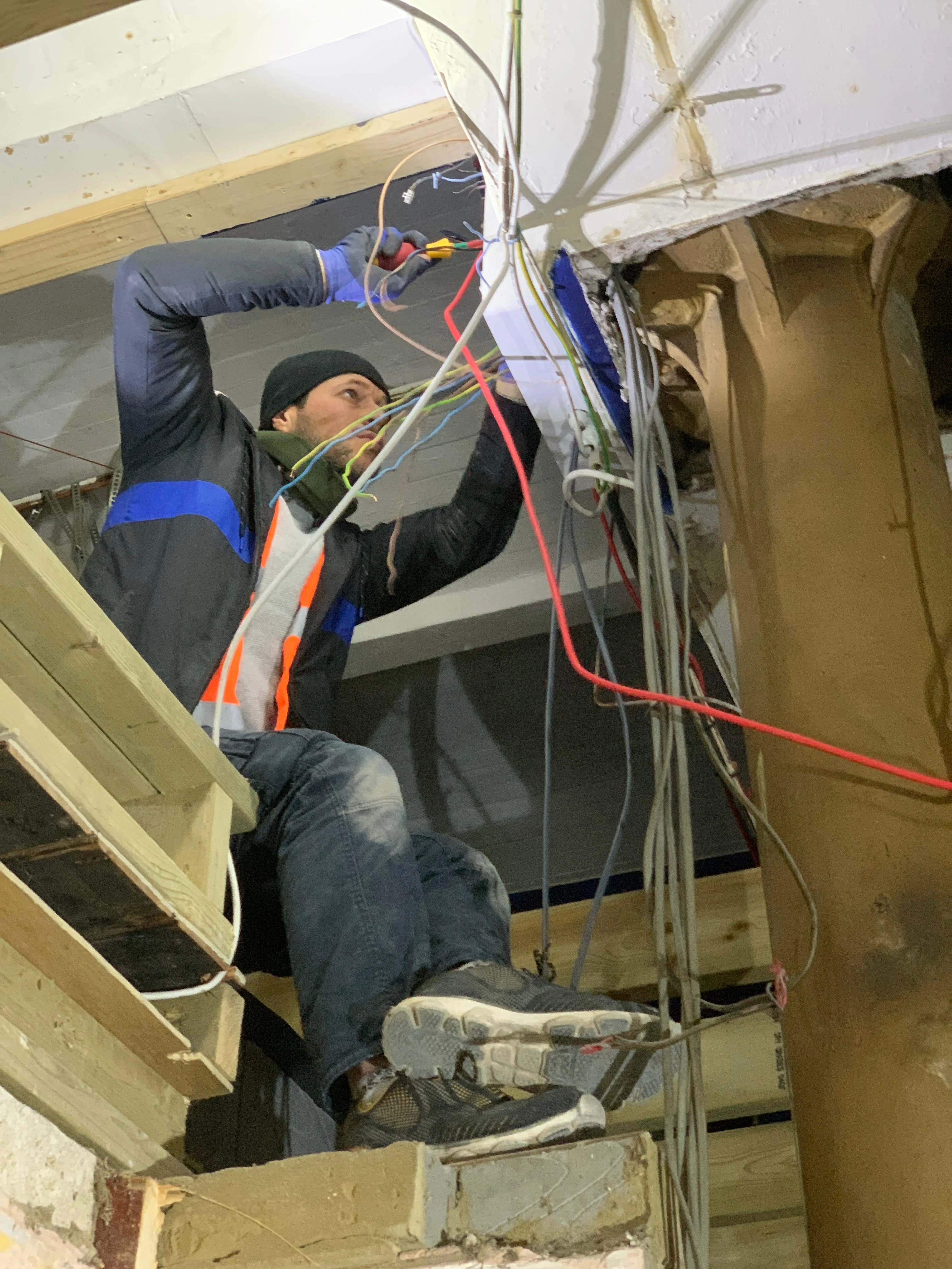 Electrician installing wiring